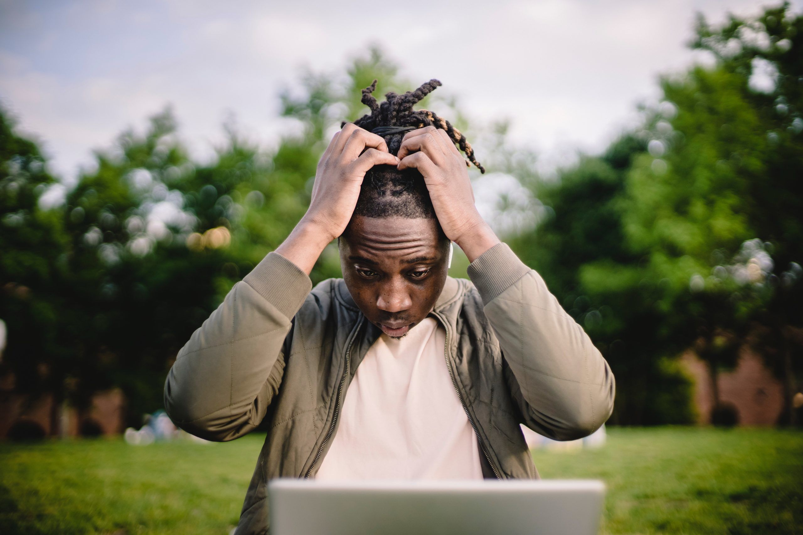 frustrated man looking at his laptop, Cyberscore, cybersecurity companies Chicago
