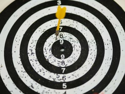 Dartboard with yellow dart stuck near the center, Cybersecurity, Ransomware Protection