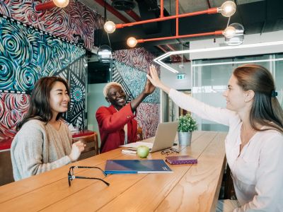 team members high five - cybersecurity measures, Cyberscore, cybersecurity companies Chicago