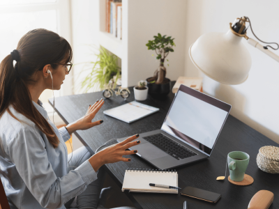Girl sitting at a home office representing remote work cybersecurity and mitigation measures, Cybersecurity, Ransomware Protection