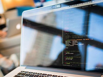 coding on laptop - EDR - Cyber Security Chicago, Cybersecurity, Ransomware Protection
