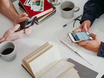 people on their cellphones - smishing, Cyberscore, cyber security companies Chicago