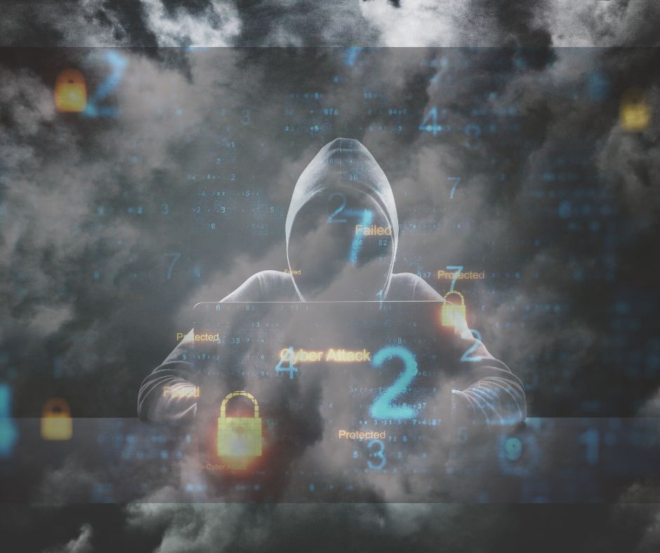 Person in hoodie in front of computer, LeadingIT, Cybersecurity