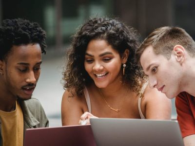 three people looking at computer - it support, Cyberscore, cybersecurity companies Chicago