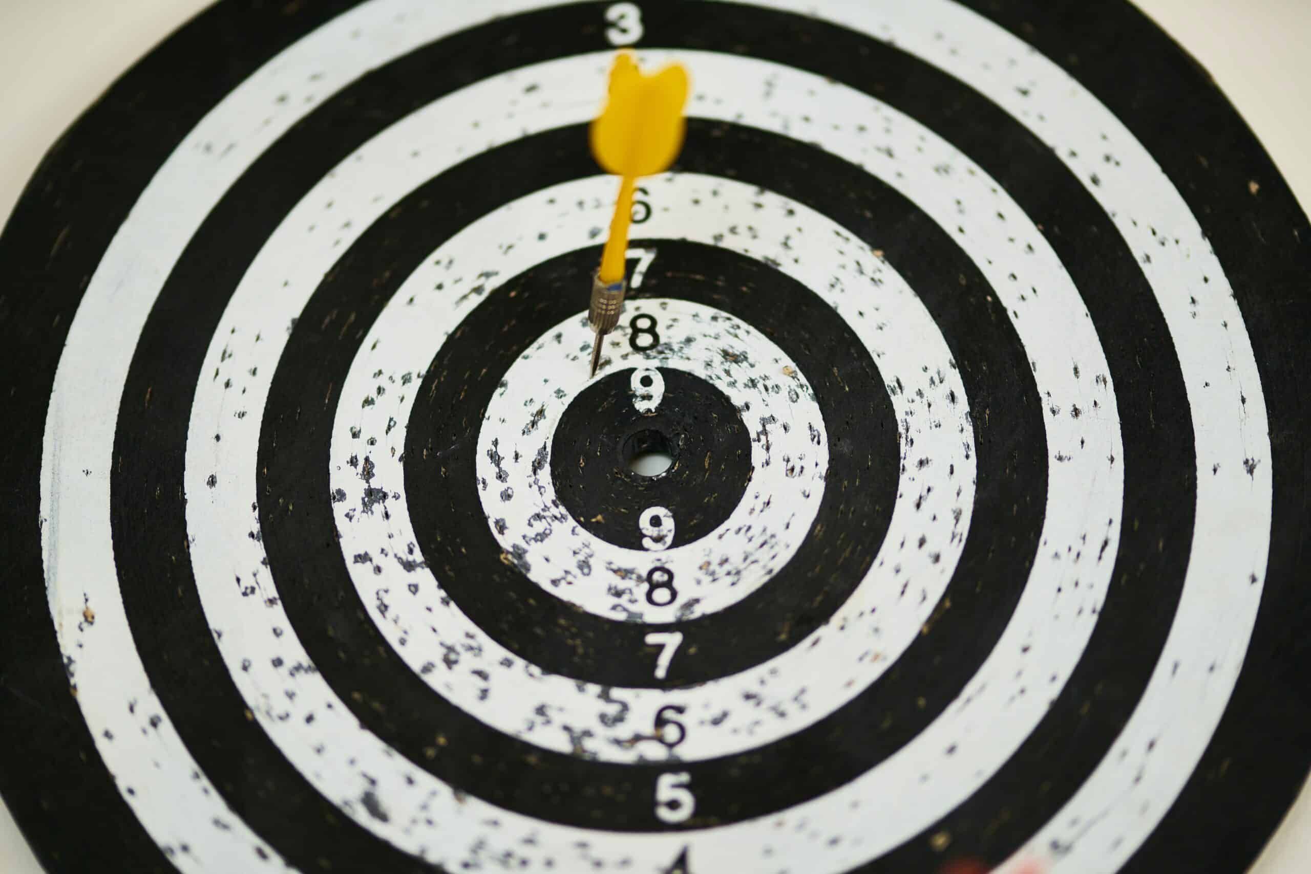 Dartboard with yellow dart stuck near the center, Cybersecurity, Ransomware Protection