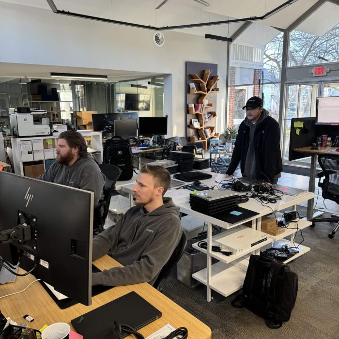 3 employees working on computers